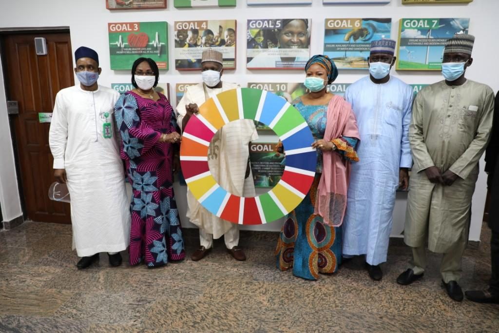Group Photograph; Middle Right, SSAP-SDGs Princess Adejoke Orelope-Adefulire, Middle Left, the Executive Governor of Gombe State, Alh. Muhammadu Inuwa Yahaya, holding the Will of progress among other Directors during his courtesy visit.